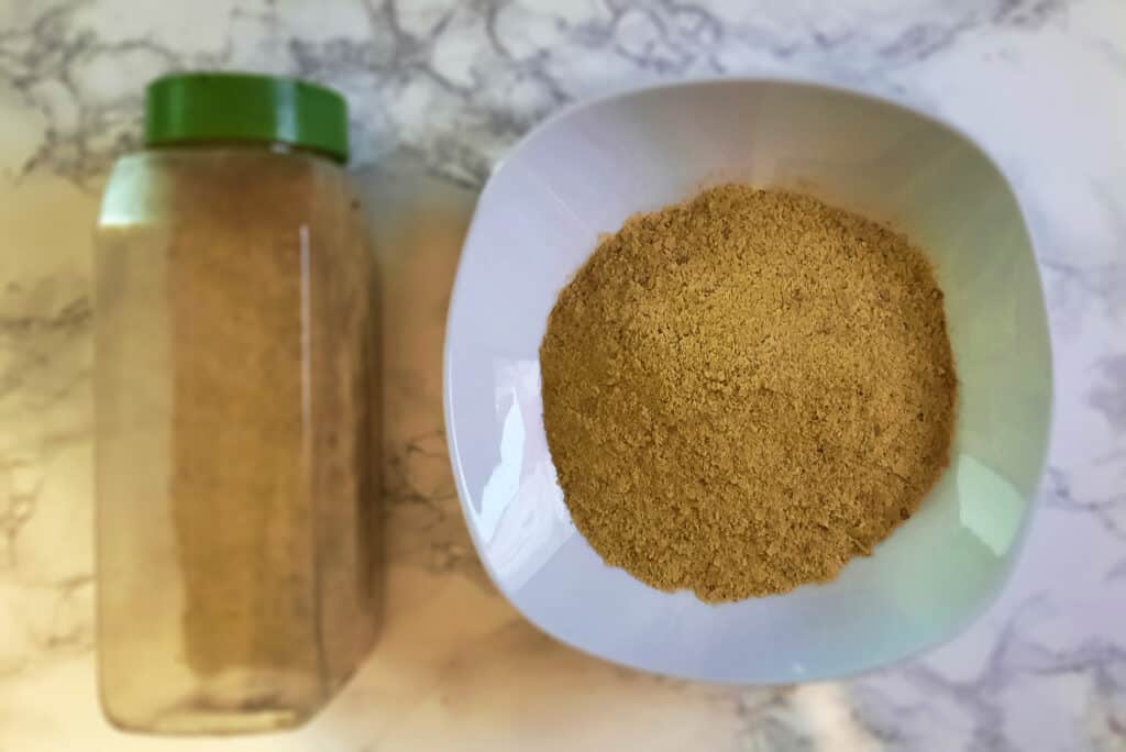 nutritional-yeast-nooch-flakes-poured-into-white-bowl