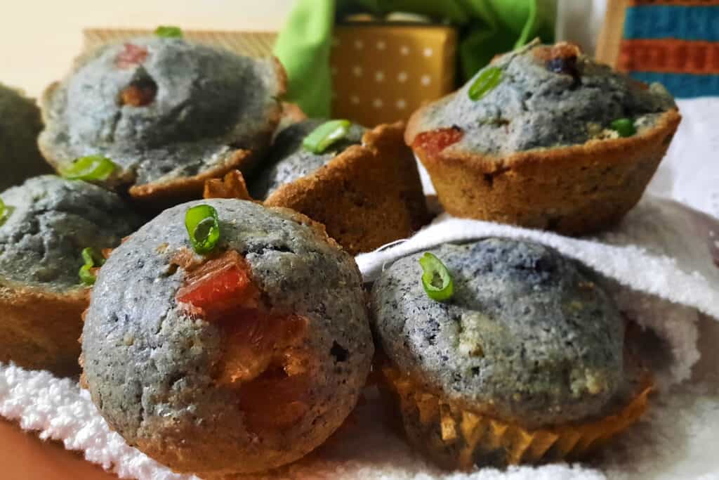 bacon-blue-corn-muffins-with-Hatch-chiles-side-view-garnished-with-green-onions