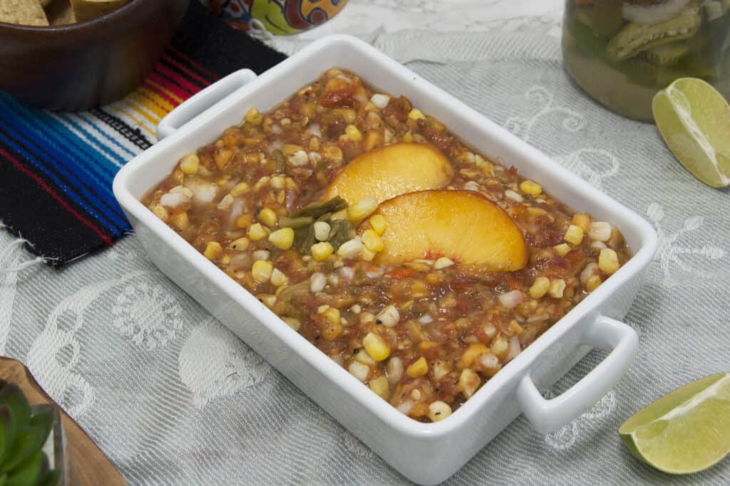 rectangular-white-dish-of-Colorado-salsa-with-Olathe-sweet-corn-Pueblo-green-chiles-and-Palisade-peaches