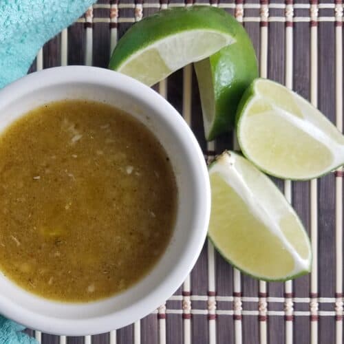 white-bowl-Cuban-mojo-sauce-garnished-with-limes