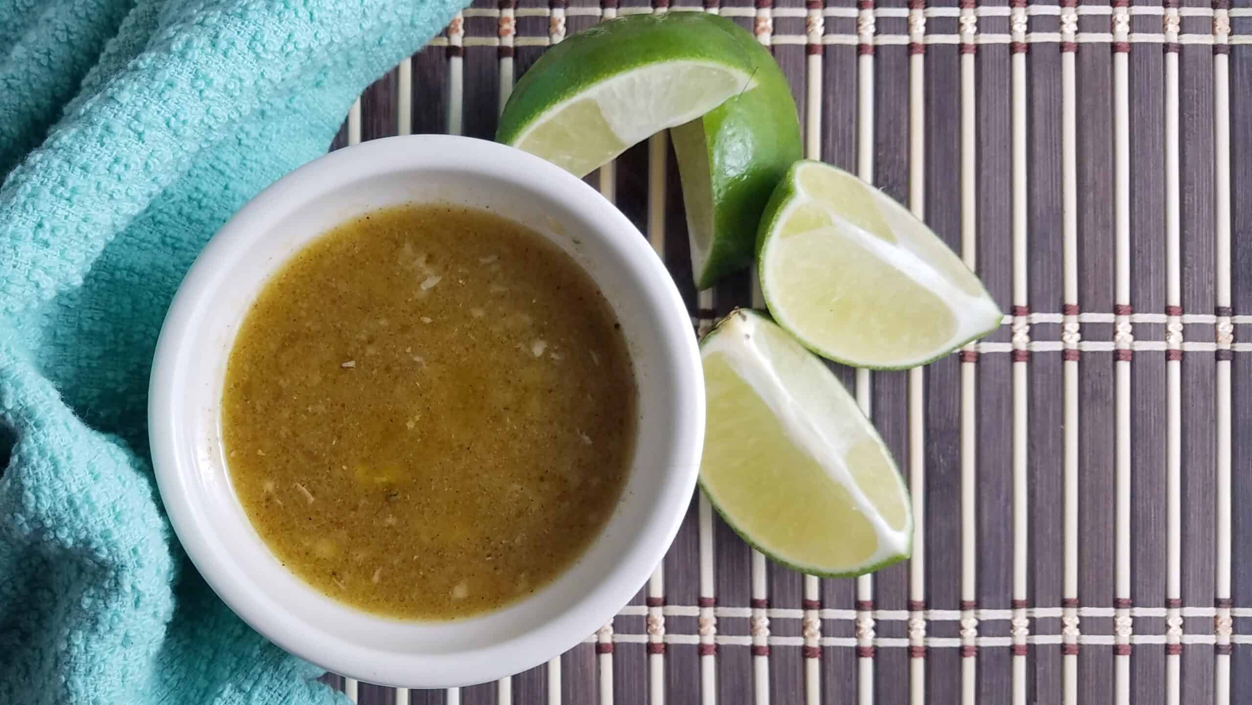 white-bowl-Cuban-mojo-sauce-garnished-with-limes