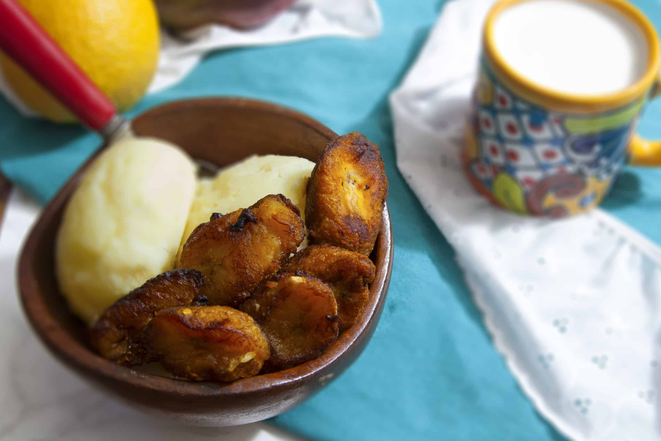 platanos-maduros-sweet-fried-plantains-served-with-vanilla-ice-cream-in-brown-bowl