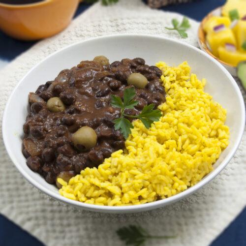 Cuban-black-beans-frijoles-negros-served-in-bowl-with-yellow-rice