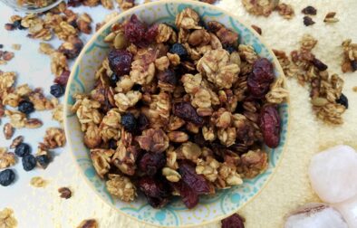 top-view-allergy-free-granola-carmelized-banana-orange-chai-in-pastel-bowl