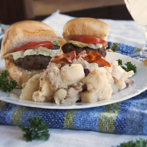 side-view-German-Potato-Salad-Kartoffelsalat-served with-two-slider-hamburgers