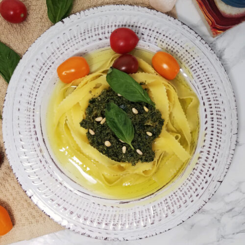 egg-noodles-topped-with-kaffir-basil-pesto-garnished-with-basil-leaves-and-tomatoes