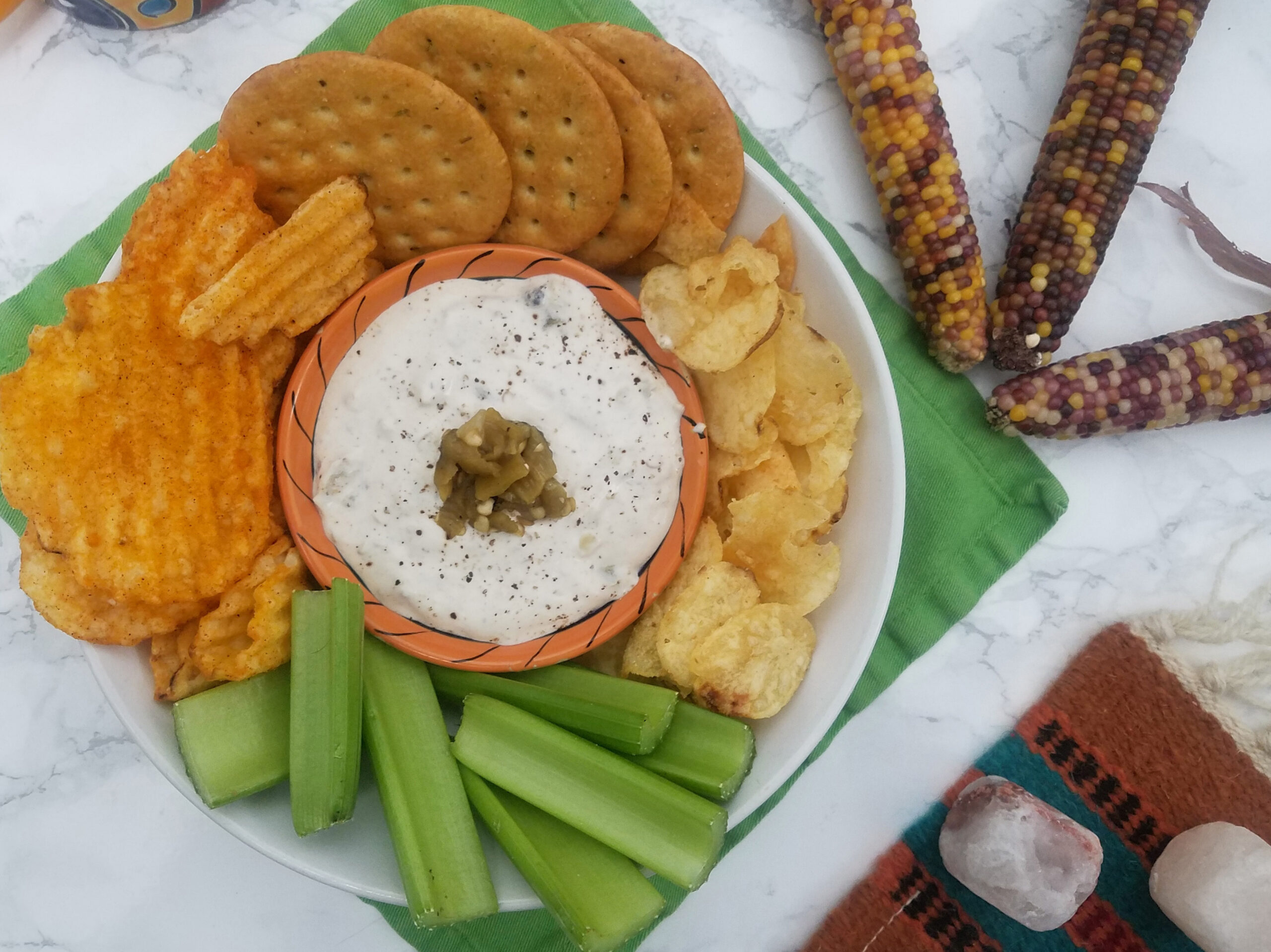 top-view-Hatch-Horsey-Sauce-surrounded-by-celery-chips-and-crackers