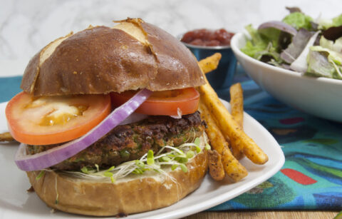 black-eyed-pea-unique-veggie-burger-recipe-served-on-bun-on-white-plate-with-fries