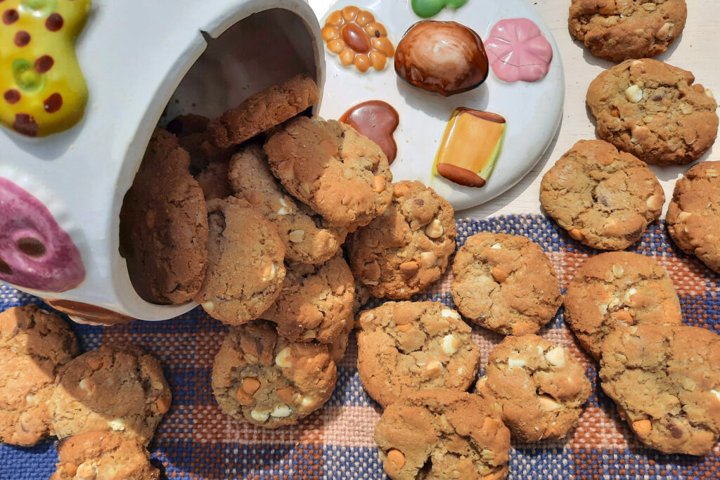 oatmeal-triple-chip-cookies-spilling-out-of-patterned-jar