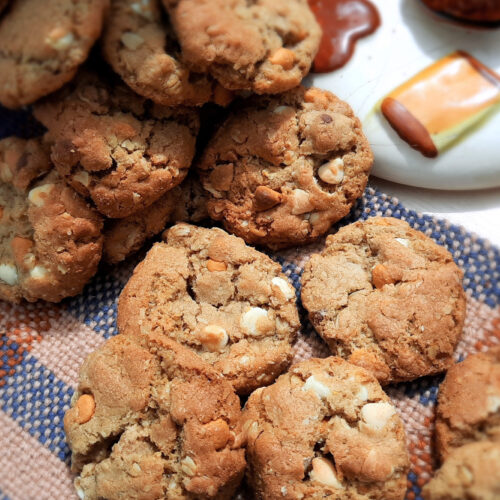 top-view-oatmeal-chocolate-chip-cookies-spilling-out-of-jar