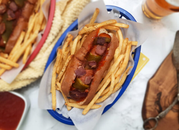 top-view-Colorado-Christmas-dog-wrapped-in-Hatch-chile-served-in-basket-of-fries