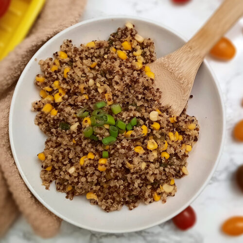 round-white-BBQ-side-dish-Honey-Butter-Quinoa-and-Corn-garnished-with-green-onions