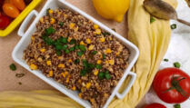 top-view-Honey-butter-quinoa-and-corn-BBQ-side-dish-garnished-with-tomatoes