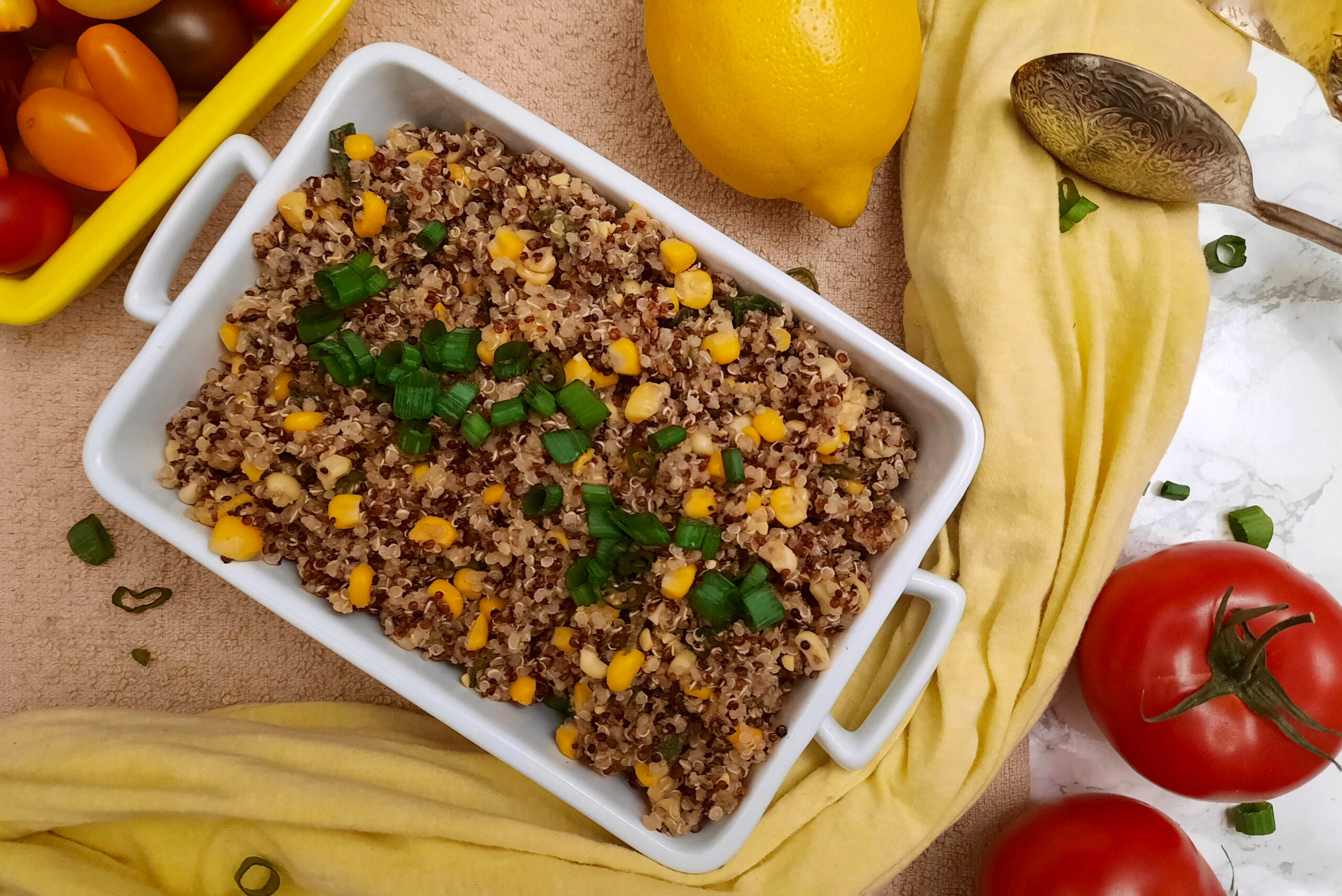 top-view-Honey-butter-quinoa-and-corn-BBQ-side-dish-garnished-with-tomatoes