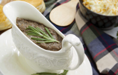 white-dish-with-ultra-umami-thick-mushroom-gravy-garnished-with-rosemary-served-with-biscuits