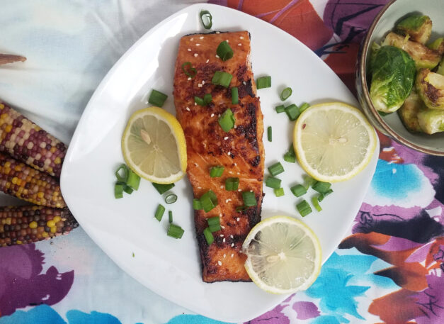 seared-and-baked-portion-hoisin-maple-salmon-served-with-brussels-corn-lemons-and-chives