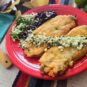 New-Mexican-style-chiles-rellenos-made-with-Hatch-chile-peppers-served-with-side-of-beans